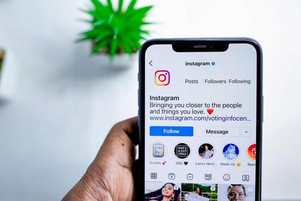 Close-up of a smartphone displaying the Instagram app, emphasizing social media connection.