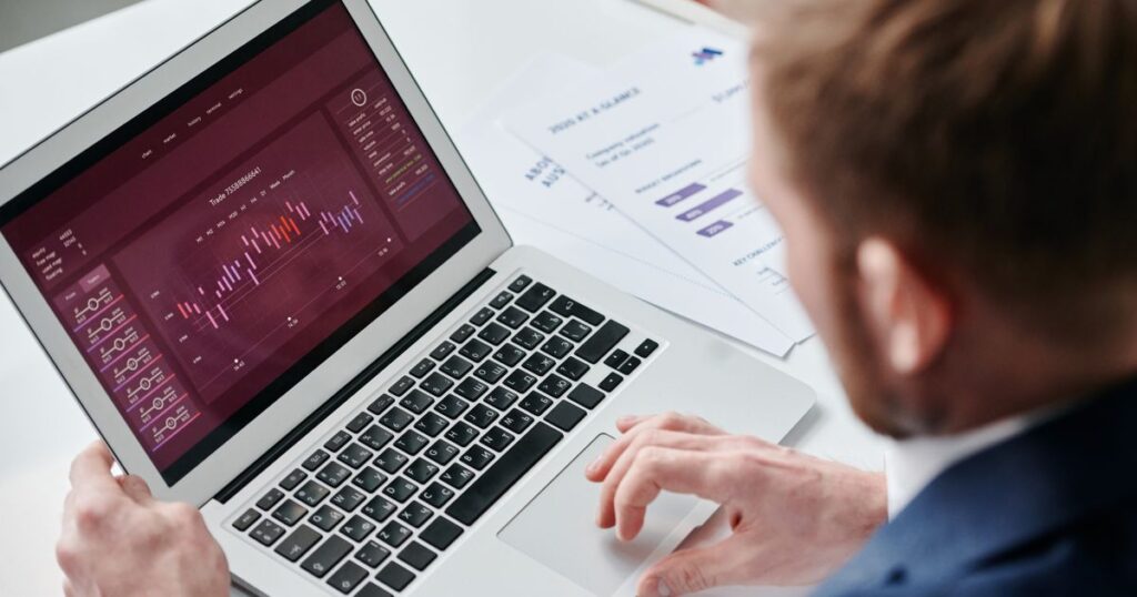 Small business owner reviewing a conversion analytics dashboard on a laptop
