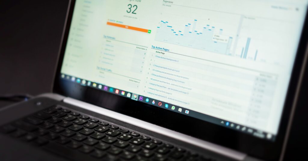 GoHighLevel alternatives comparison shown on a laptop analytics dashboard — featured image for thesmartfunnel.com